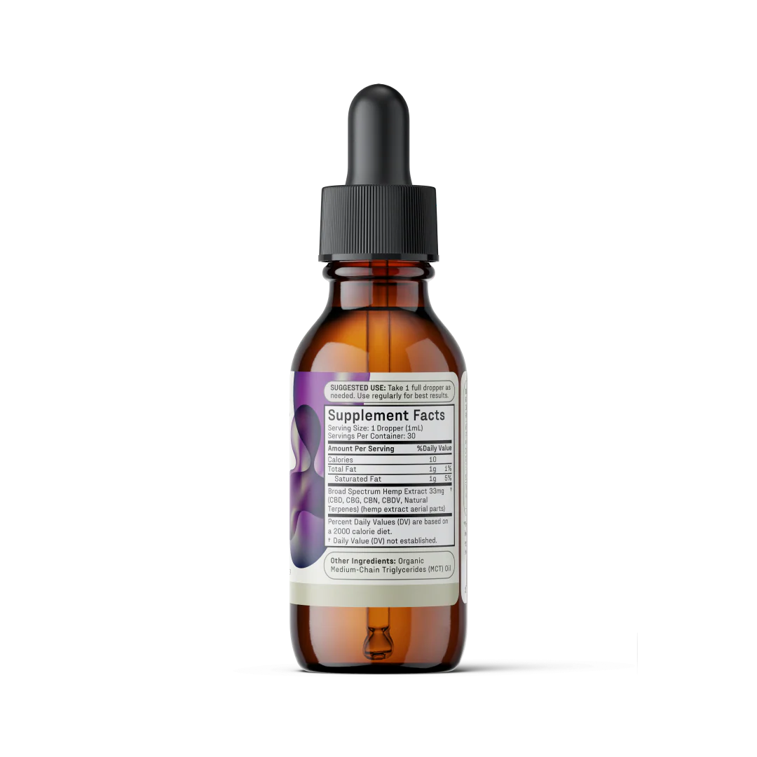 A brown glass dropper bottle with a black cap, labeled as Medterra's Enhanced Relief Broad Spectrum CBD Oil dietary supplement. The front label displays "Supplement Facts" and dosage instructions. The background shows a hint of a purple design, suggesting the potential benefits of the hemp plant's entourage effect. The bottle is on a neutral gray surface.