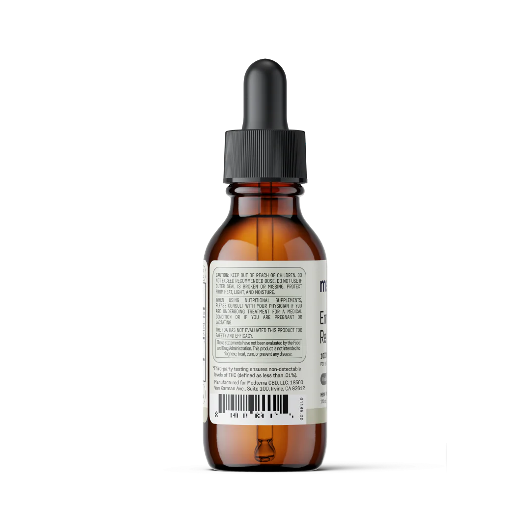 Rear view of Enhanced Relief Broad Spectrum CBD Oil bottle showing the back label with caution text and barcode on white