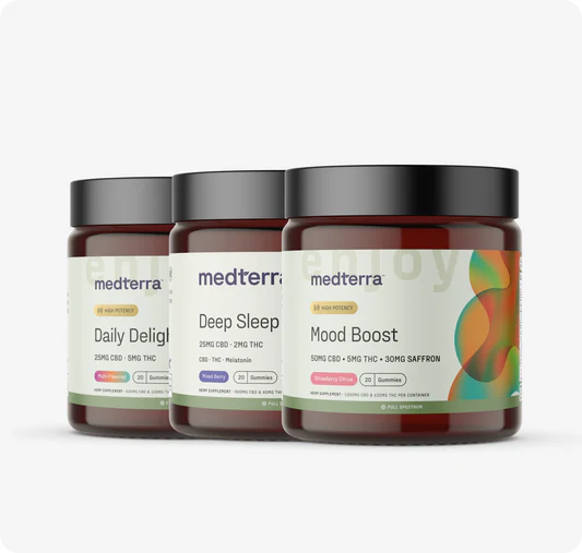 Front view of three Medterra gummy jars (Daily Delight, Deep Sleep, Mood Boost) showing product labels and colorful packaging on a light gray background