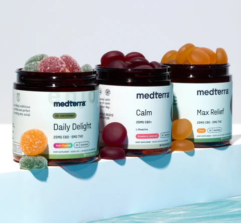 Three jars of Medterra CBD gummies: Daily Delight, Calm, and Max Relief, with colorful gummies on top.