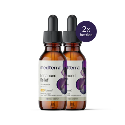 Front of Enhanced Relief Broad Spectrum CBD Oil showing two amber dropper bottles with purple label and citrus badge on white