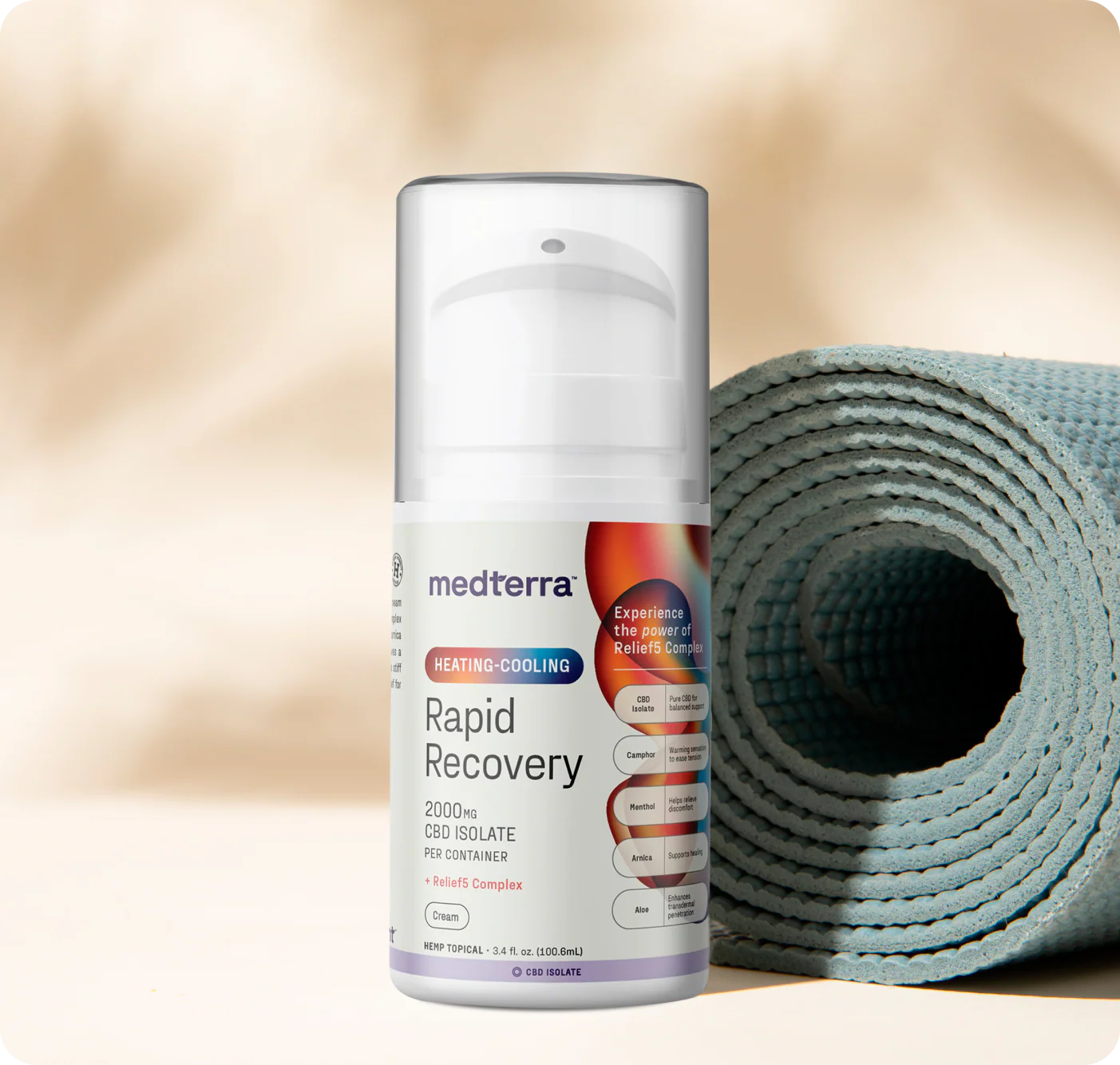 Front view of Heating-Cooling Rapid Recovery CBD Cream pump bottle showing 2000 mg label beside a rolled blue yoga mat