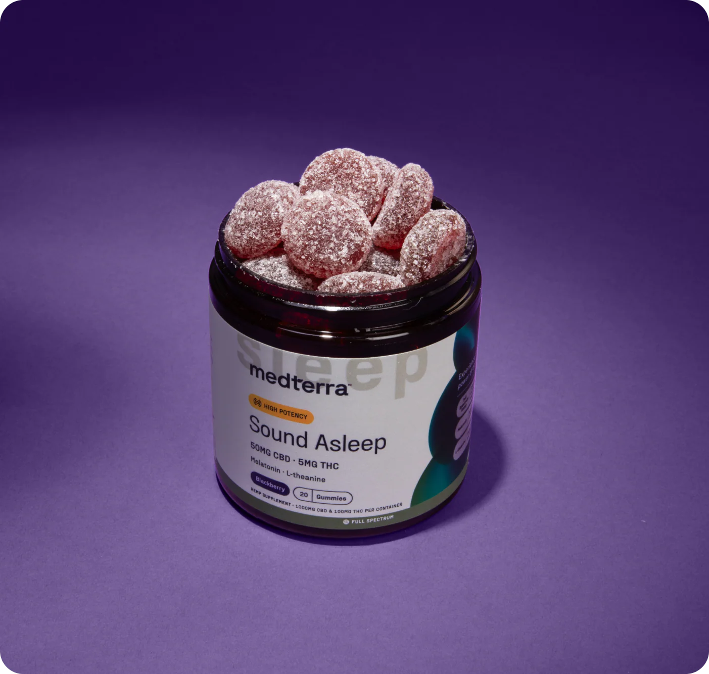 Top-front view of Sound Asleep jar showcasing sugar-coated round gummies and label showing 50mg CBD and 5mg THC on purple background